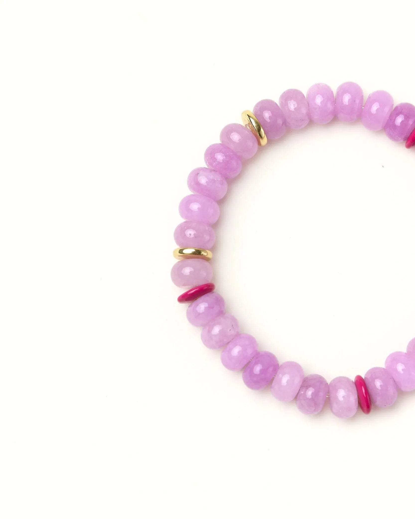 Close-up flat lay of Lavender quartz beaded bracelet with gold spacer accents on a soft cream background