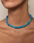 Azure Valerie Necklace styled on a model, elegantly resting on the collarbone, showcasing its bold yet refined design.