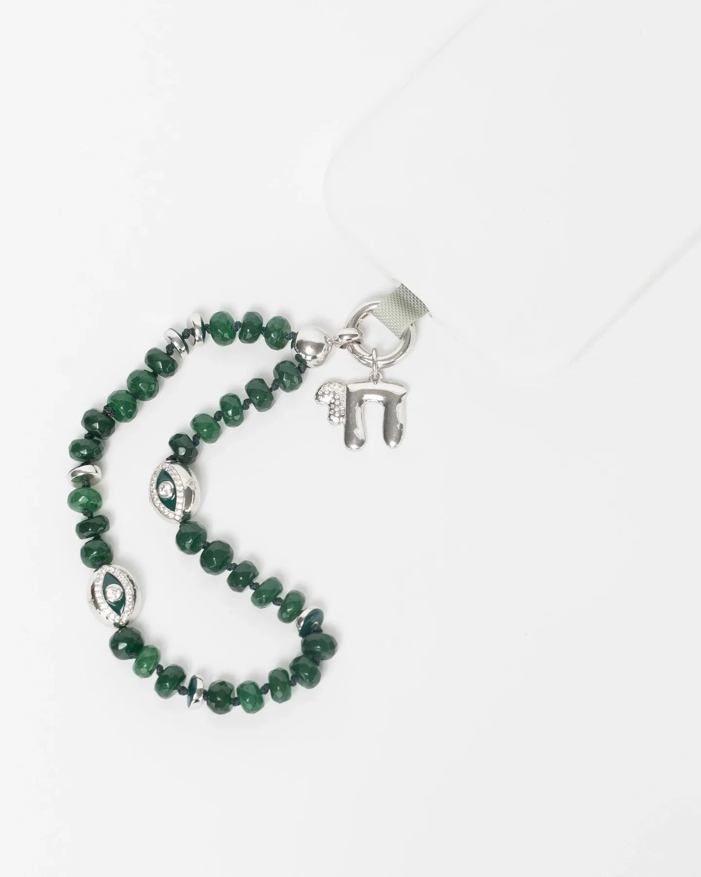 MyAleph Chai Necklace styled with emerald phone charm strap, silver Hebrew life symbol pendant with white stone