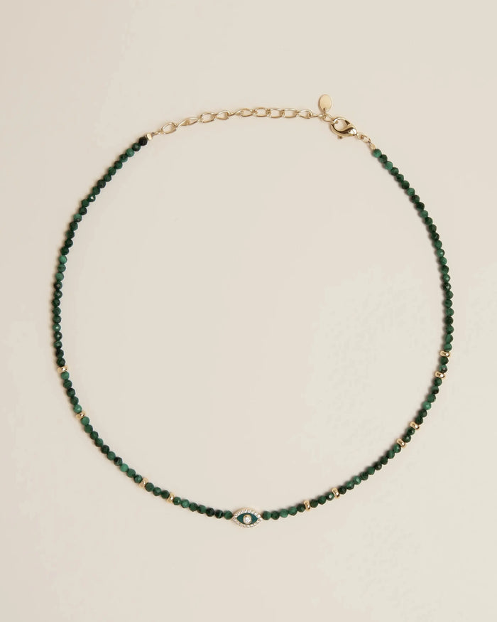 Flatlay of the Julianna Necklace in Malachite, showcasing deep green malachite beads and gold-plated adjustable clasp.